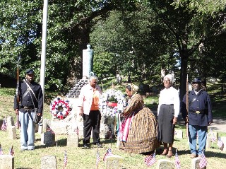 Families of USCT lay wreath at GAR Mound, Oak Ridge Cemetery - Photo by Donna Catlin
